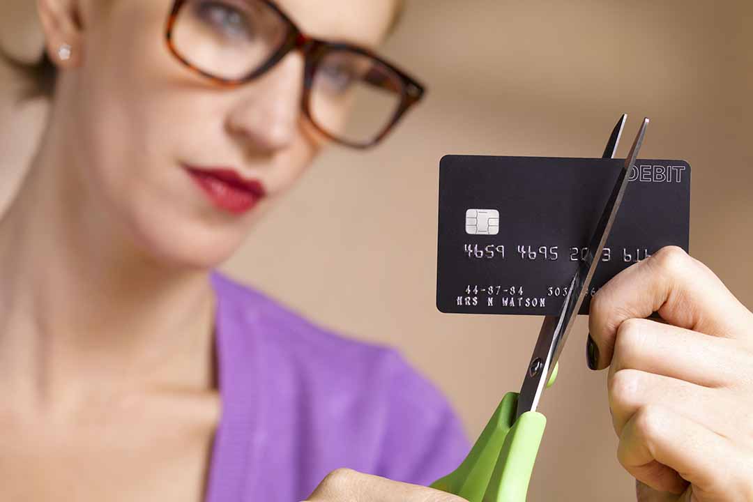 businesswoman-cutting-up-credit-card-184233403-5aa456730e23d90037a41eb3-1080.jpg